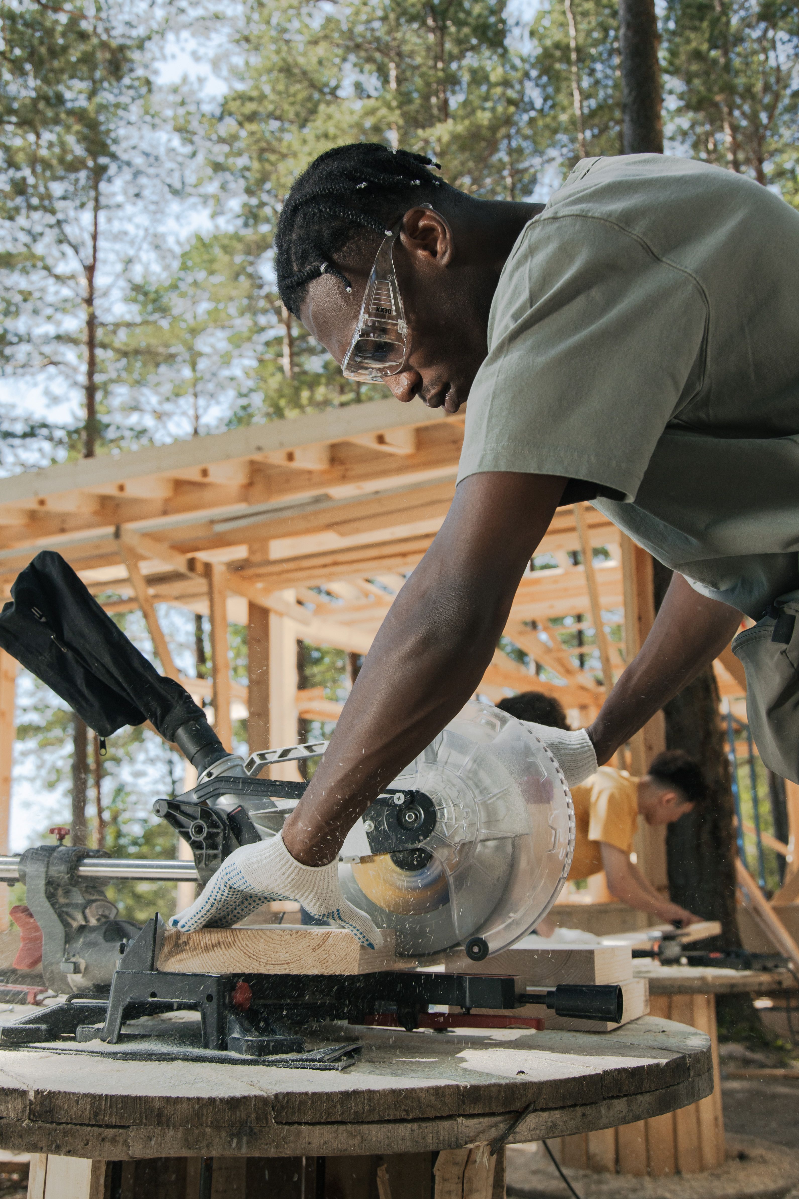 Skilled carpenter using circular saw